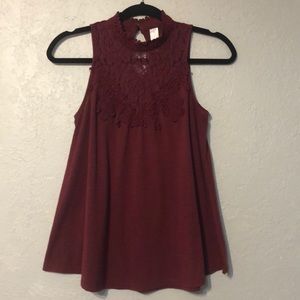 Wine color top. Size medium